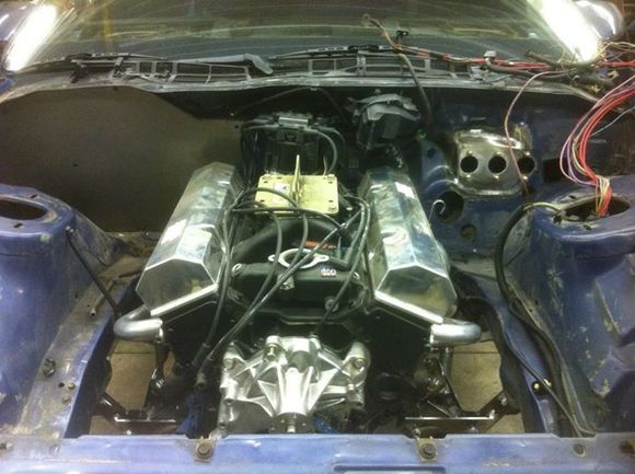 6. Small block w headers mounted on new tubular k member. 430hp 355. Hydraulic roller valve train. 6" rods and lightweight pistons. World cast iron heads. Probably upgrade it in the future. You can never have enough horsepower.