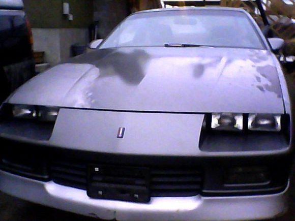 front the more darkish parts on the hood is where paint was peeling the people who i bought the car left some duplicolor spray in the trunk decided to spray it so this was a before pic i guess