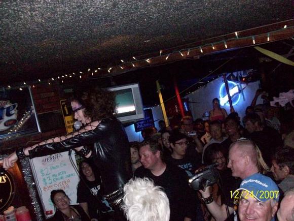MILD MANNERED DESK JOB BY DAY ... FEMALE RE- INCARNATION OF RONNIE JAMES DIO BY NIGHT. THIS CHICK CAN BRING IT.