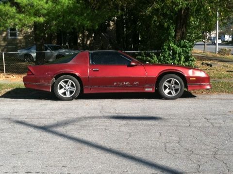 faded paint and dent on fender