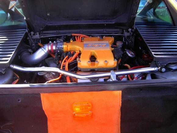 PICT0014 1 Shows my Orange &amp; Black Carpet in Trunk and my Mid Engine 207ci, 255hp, Air Supercharged, Headers, Jet Chip. Under Pulleys. E3 Plark Plugs. Cat Back Eshaust. No Cat?? 5 Speed but L@@KING for a Posi Unit to put in it. Any Ideas.