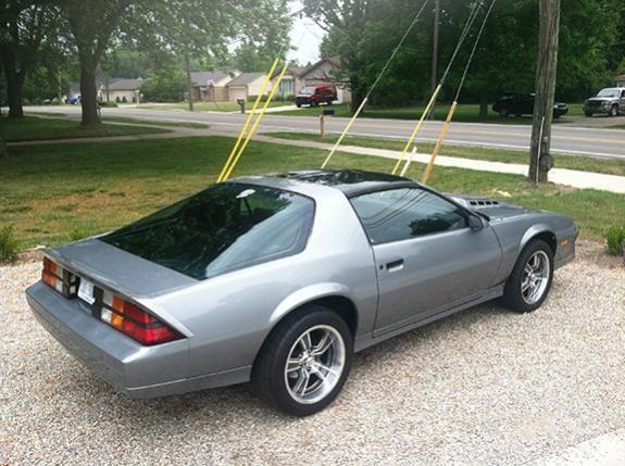 Camaro with new wheels and tires before hood work and black decals