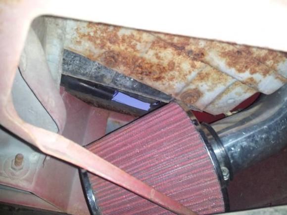 Where CAI pipes meet filter above the splash guard.