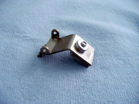 4 - Washers mounted on outside. Rivet trimmed.