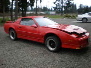 The pic in the Craigslist ad. No engine, just a T5 tranny. No hood shocks, either, just a stick to prop it up with.  O_o

(Hood shocks were purchaced shortly after bringing the car home)