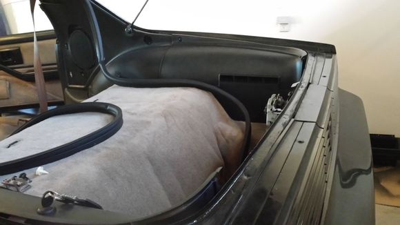 Refitting of the rear panels after painting and new carpet fitments.