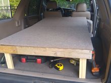 With the seats down, the bed platform extends about 6ft (I took this picture before I put the sides and bottom on the "toolbox")