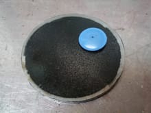 Bottom plate with rubber check valve