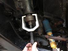 apply the pitman arm puller, put some tension on it, and give it a few wacks with your hammer to break it free