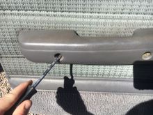 the screw covers for the door handle pull straight out.