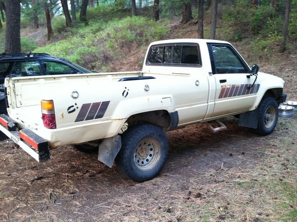 The beautiful deck railing and white bumper.  Welded up solid though with a hitch mount.  I'll do it black and leave it for now. Deer hoof marks because... Badge of honor? Might explain the front end body damage and bent tie rod... Climb in step for a super short farmer's wife i assume. It'll go.