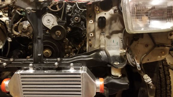 The tricky part here was getting the piping yhrough the radiator support without hitting the inner fender well. Measured and layed it out 3 times to be sure before hitting it with the hole saw. Luckily came out perfect without an 1/8" to spare.