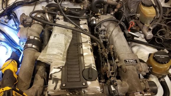 I had to do a slight modification in order for the curise control cable to be held properly.
 Unbolted the bracket cut the one fork off moved it up next to throttle cable and tacked it place. Ouick sanding and shot of paint cant even tell i touched it
