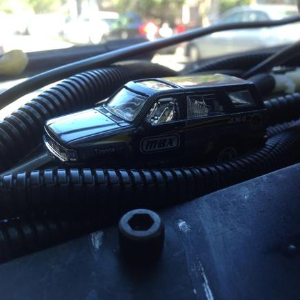 crawling its way through the mess of wires and hoses that go to the dash board gauges