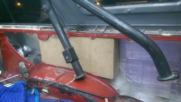 Box was roughly 25-29" long and rests on top of the fender well.  Notice the cutout supports to be able to get the box even in there