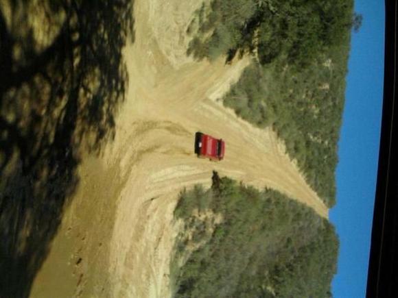 my bro in the jeep goin up truck hill