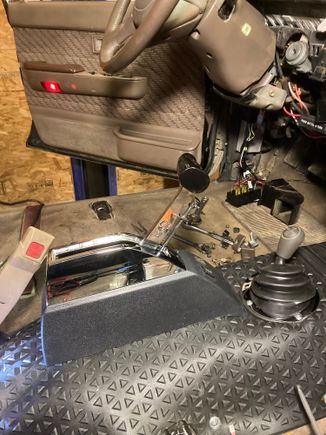 I covered the hump with a cut up cargo mat, far from stock but it'll do.