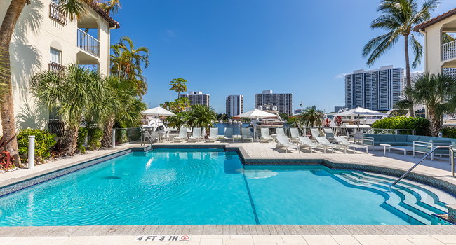 Outdoor, saltwater pool and sundeck overlooks the marina and views of the city